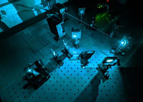 pieces of laser equipment on table in use